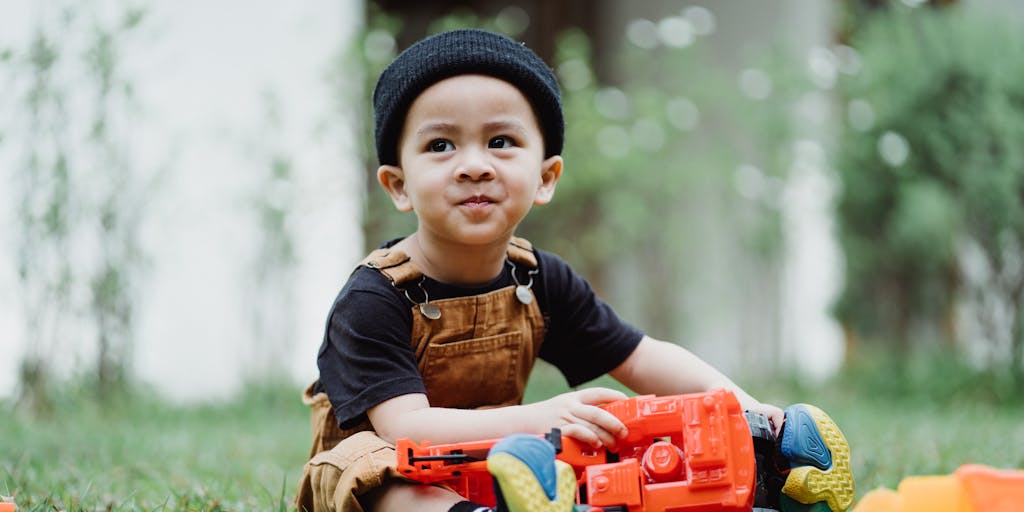 A split image showing two paths: one leading to a graduation cap and the other to a child playing with toys. The graduation cap symbolizes the end of child support when a child reaches adulthood, while the toys represent the earlier years of dependency.