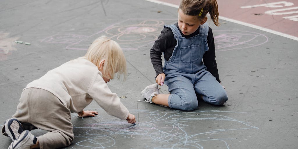 A close-up shot of a hand holding a 'Paid in Full' receipt with a child's drawing in the background. The drawing represents dreams and aspirations, highlighting the positive impact of financial support on a child's future.