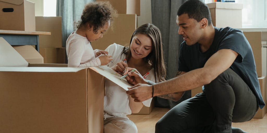 A close-up shot of a couple's hands intertwined, with a child’s drawing of a family in the background. This image symbolizes unity and love, while subtly hinting at the complexities of their situation regarding child support.