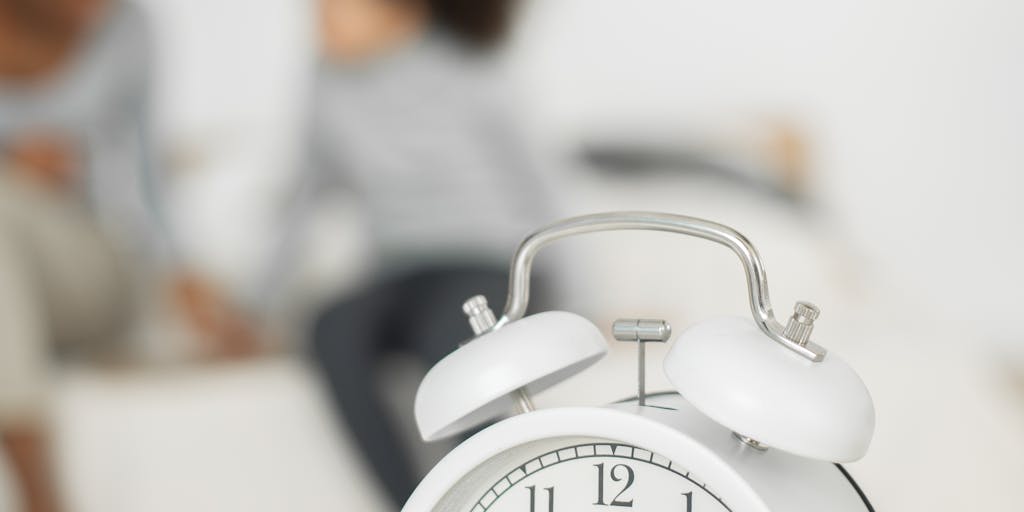 A split image showing a clock on one side and a family sitting together on the other. The clock represents the time it takes for child support processes, while the family symbolizes the emotional aspect of waiting for support. The background can be a soft gradient to evoke a sense of time passing.