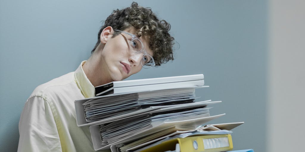 A close-up shot of a person holding a document labeled 'Child Support Lien Removal' with a relieved expression on their face, symbolizing the emotional journey of overcoming financial burdens. The background features a blurred office setting to convey a professional atmosphere.